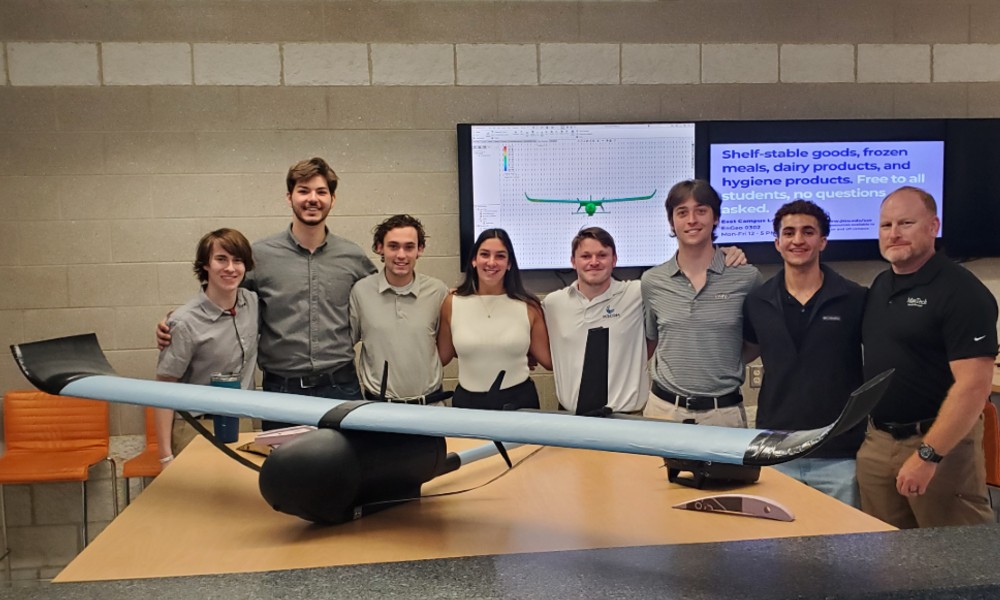 Capstone team with their Drone Accelerator Project and MANTECH mentor